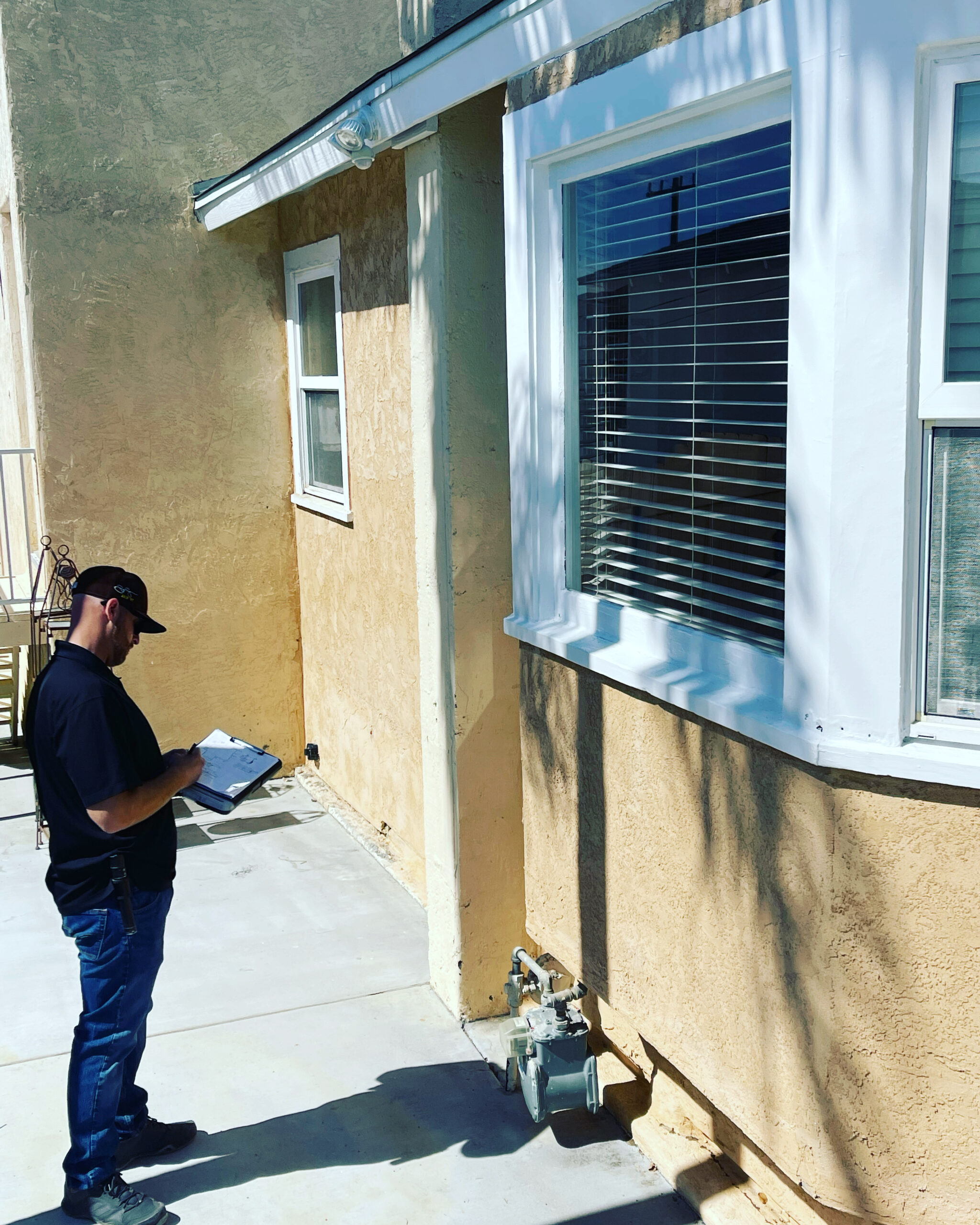 Termite inspector inspecting a house for termites