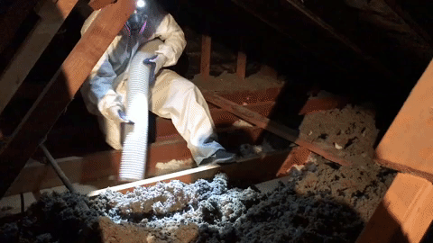 Technicians removing old, contaminated insulation and rep[lacing with fresh insulation.