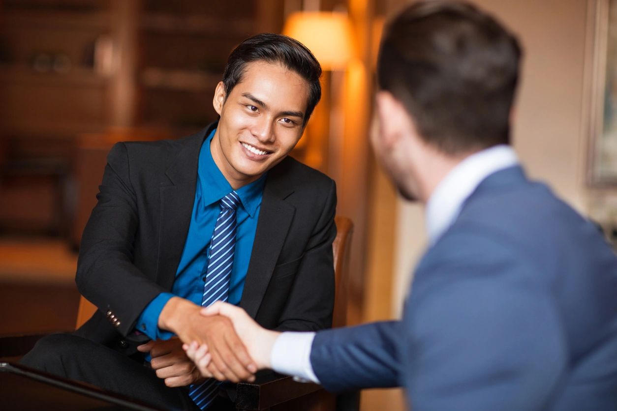 Two people shaking hands.