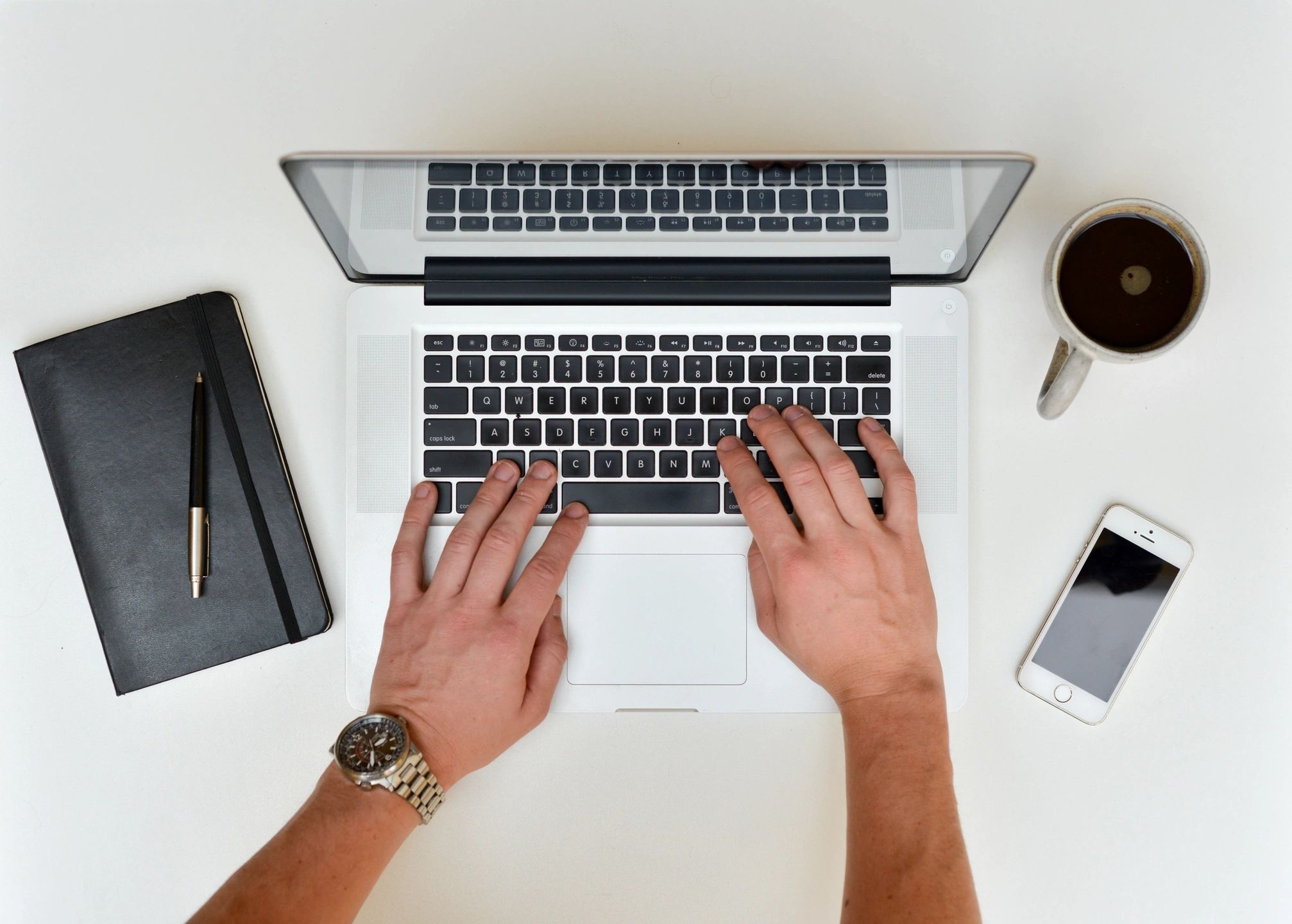 Laptop with someone typing